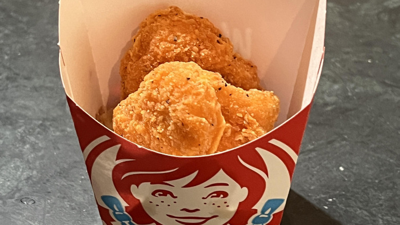 Wendy's 4-piece chicken nuggets in a Wendy's container
