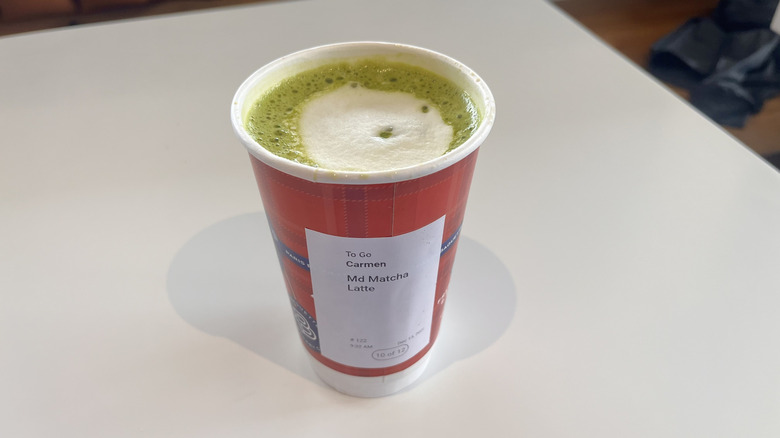 Matcha latte side view on a table