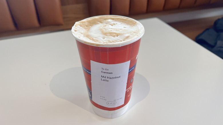 Hazelnut latte in a red cup
