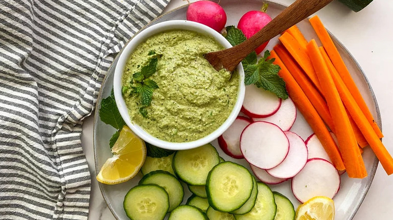 Summery Zucchini Hummus on plate of freshly cut veggies