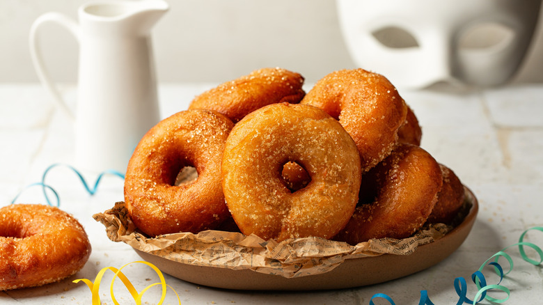 Freshly fried potato donuts in a basket