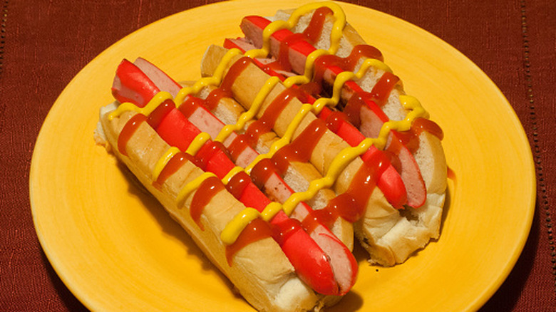 Close up of two red snapper hot dog in bun