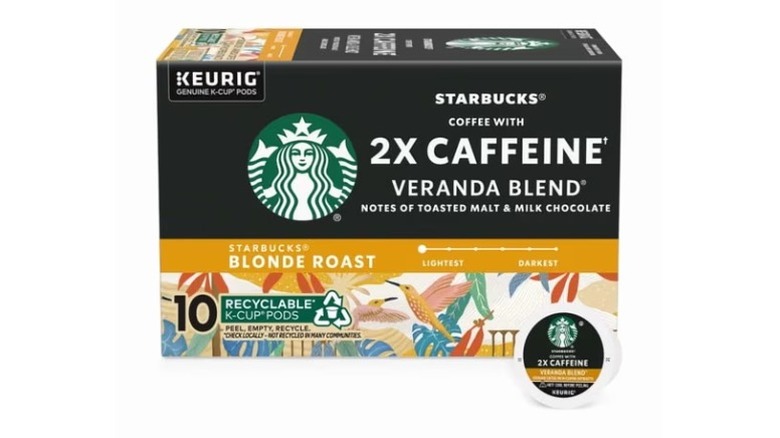 A box of Starbucks 2X Caffeine Veranda Blend Blonde Roast, with one loose pod in front, on a white background