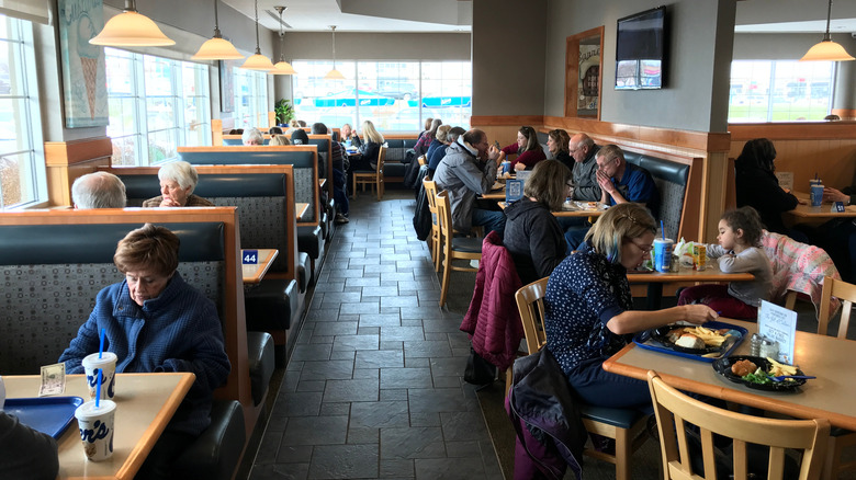 Families dine in at a cozy Culver's restaurant