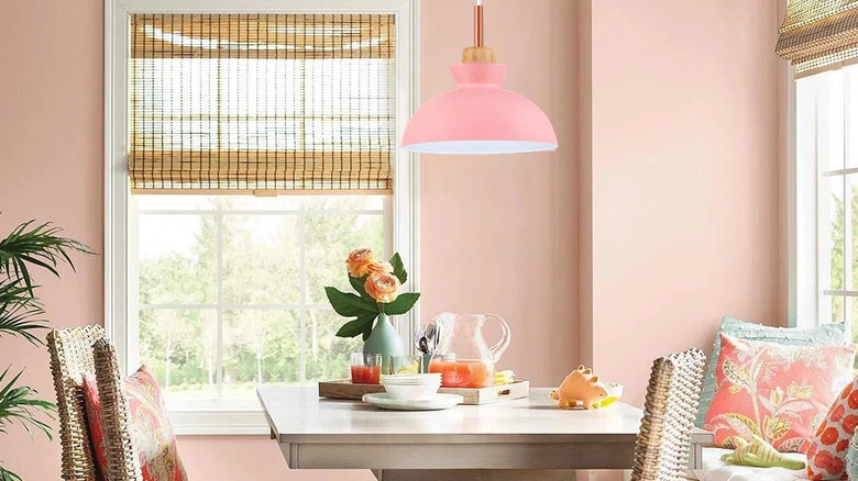 Pink colored kitchen with pink ceiling pendant lamp