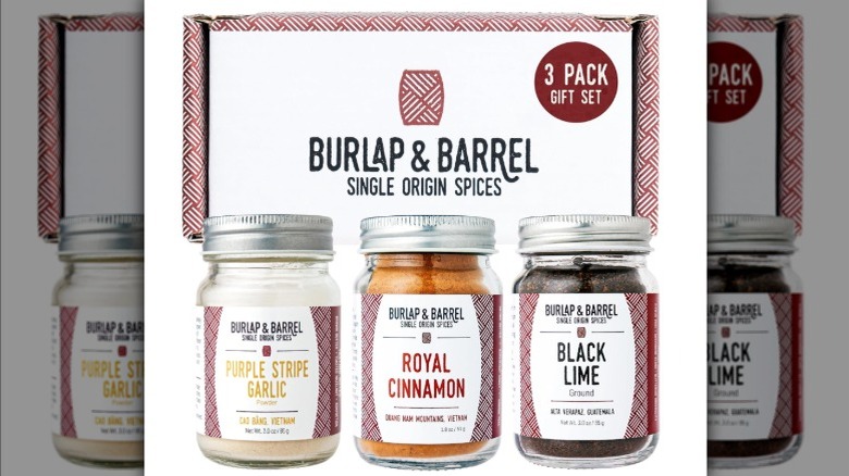 Spice jars with box on white background