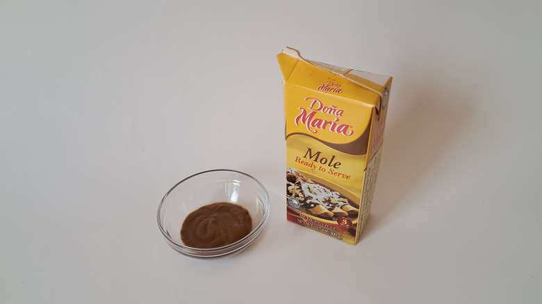 Bowl of mole and carton