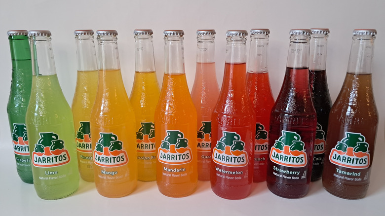 twelve sodas in glass bottles