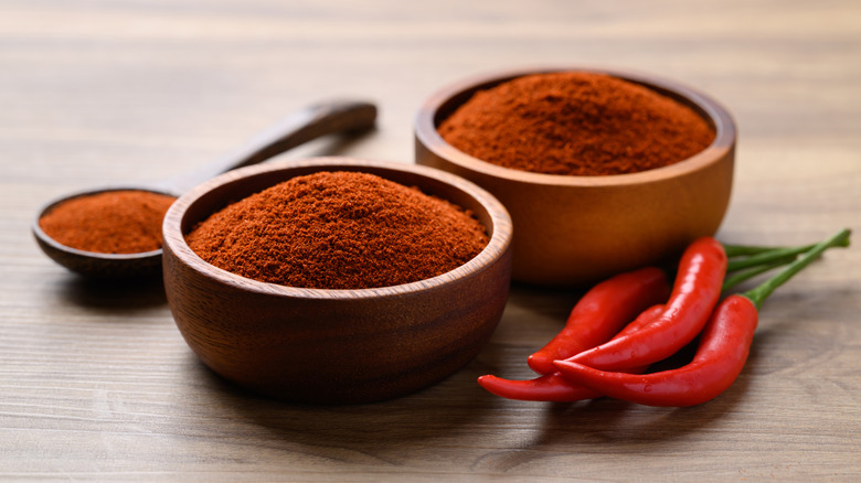Chili powder in two small wooden bowls