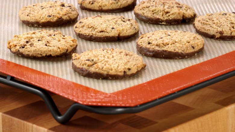 Cookies on the corner of a silicone baking mat
