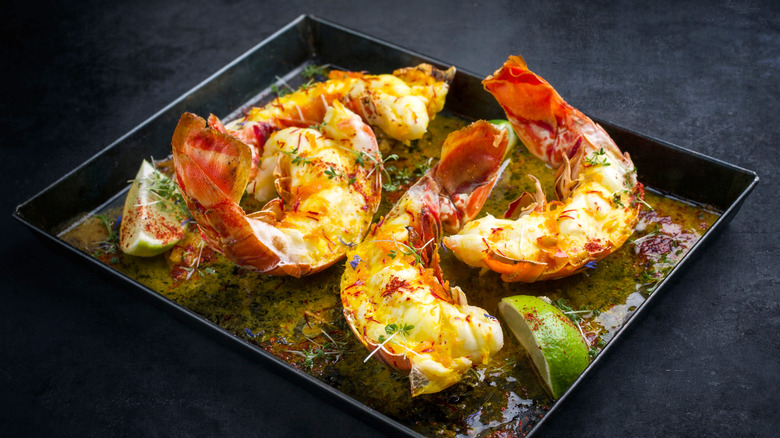 Cooked lobster tails in pan