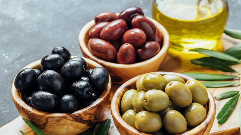 Different colored olives and oil