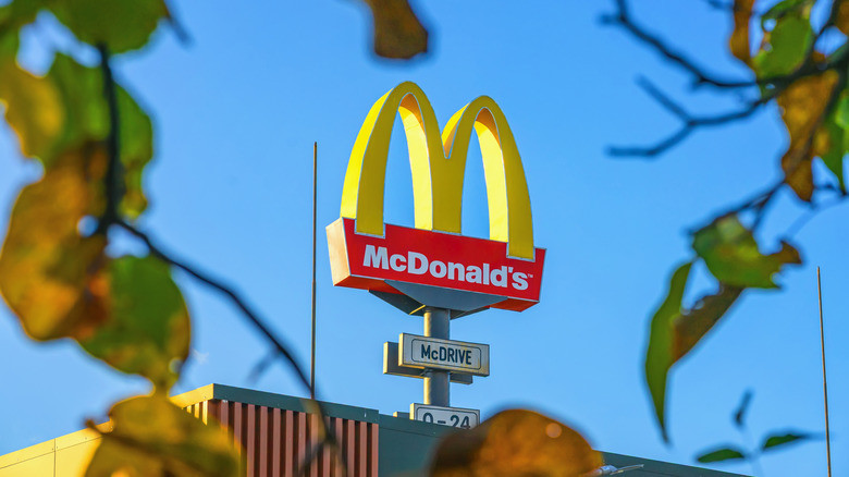 A McDonald's sign against a blue sky