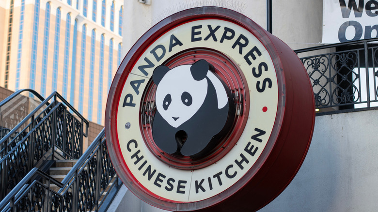 A Panda Express sign with its panda logo