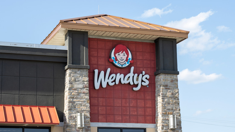 A Wendy's building with a girl on the logo