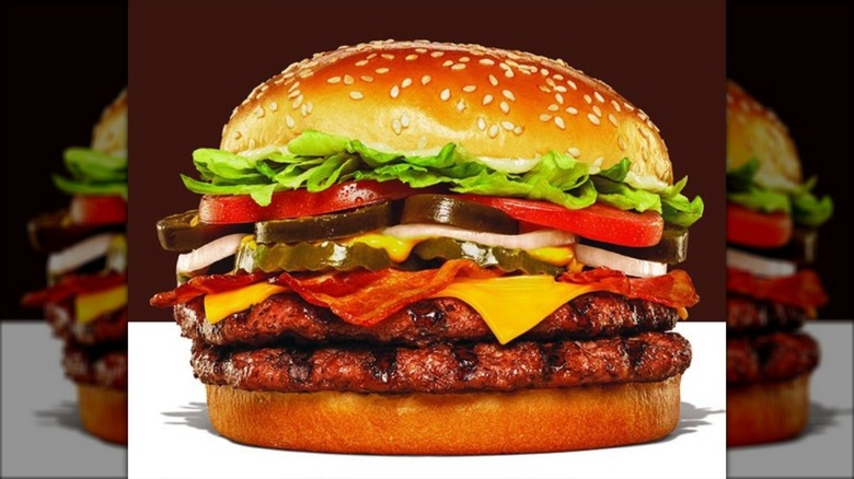 Burger King Texas Double Whopper burger against white and brown background