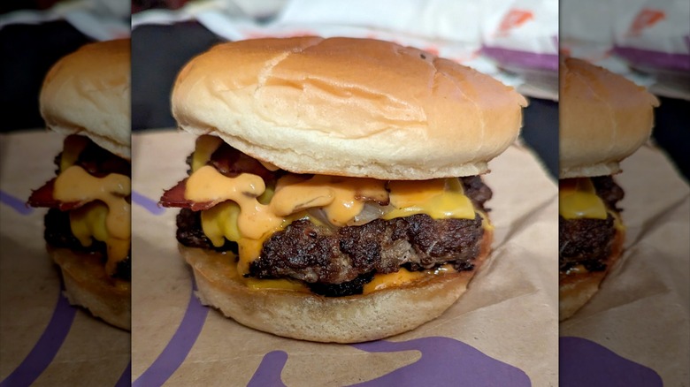 Jack in the Box Bacon Double Smashed Jack burger on top of paper bag