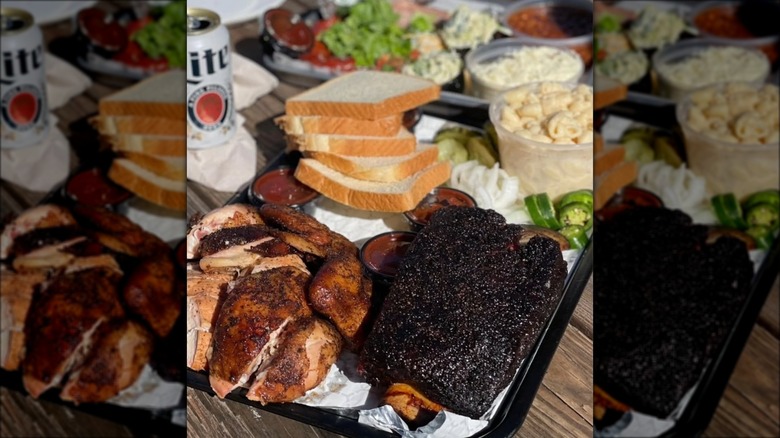 A platter of CorkScrew BBQ meats and sides with a Lite beer