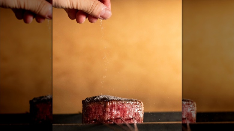 Chef seasoning wagyu at Karyu Miami
