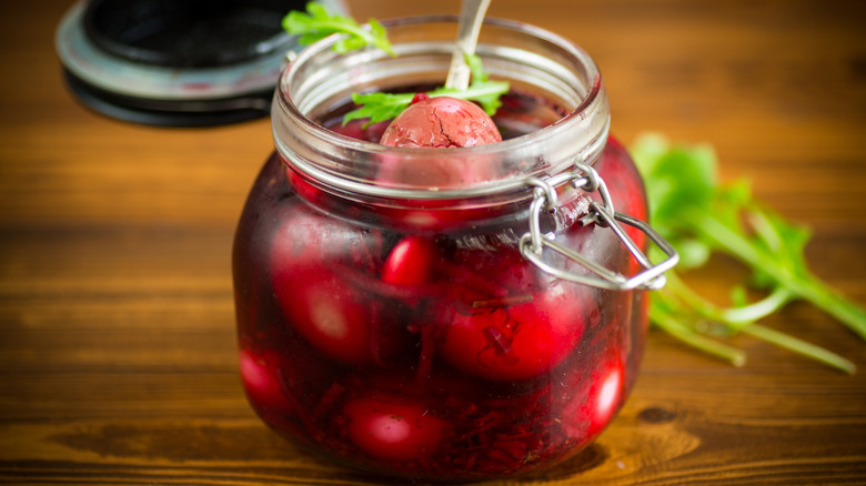 Pickled eggs in beet juice in a jar.