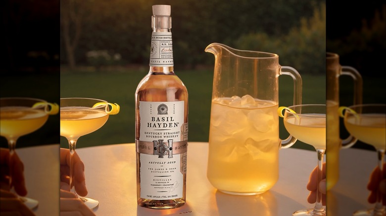 Bottle of Basil Hayden with pitcher and cocktails