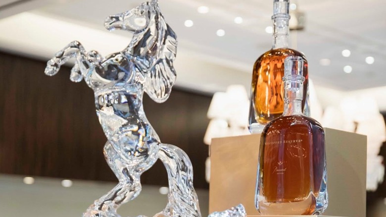 Two bottles of Woodford Reserve Baccarat with crystal horse