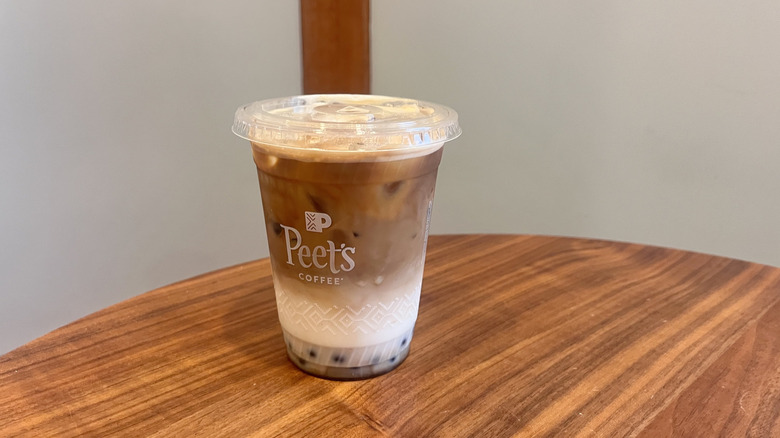 Iced Vanilla Latte with Popping Pearls on a table