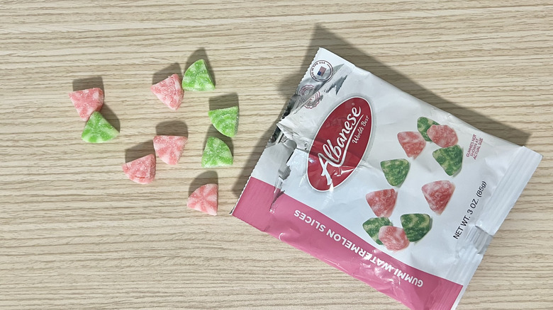 Albanese gummy watermelon slices coming out of the bag.