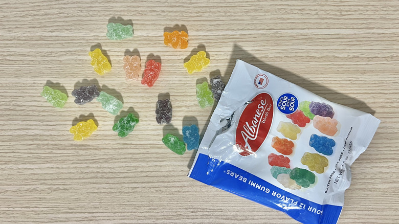 Albanese sour gummy bears coming out of the bag.
