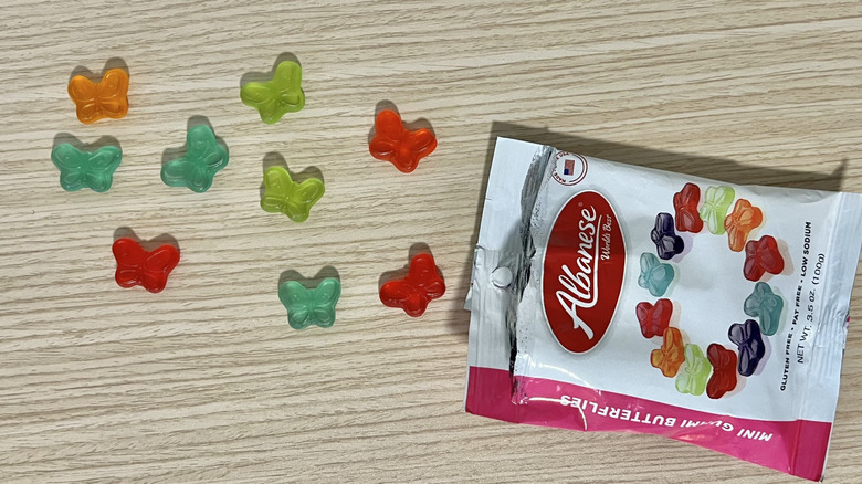 Albanese mini gummy butterflies coming out of bag.