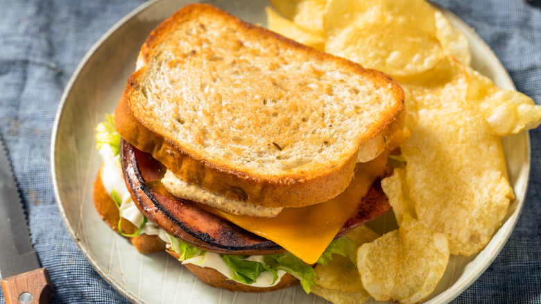 Fried bologna sandwich with chips