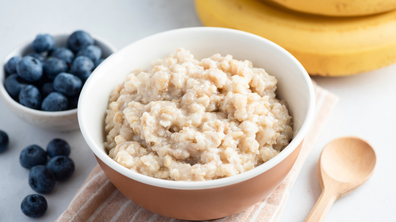 Oatmeal in a bowl with blueberries and bananas