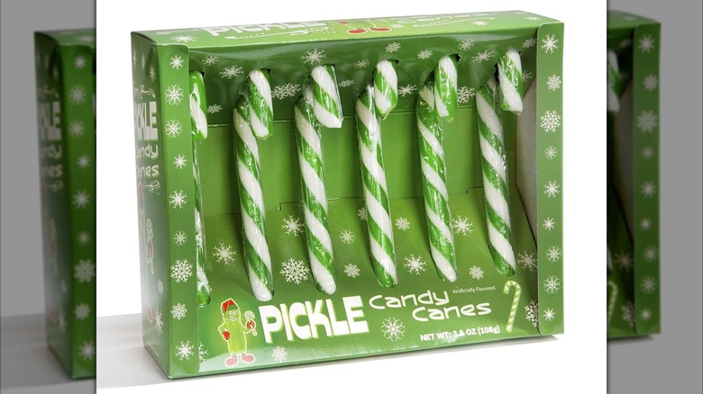 Green box of Fancy Pickle Flavored Candy Canes with white snowflake pattern