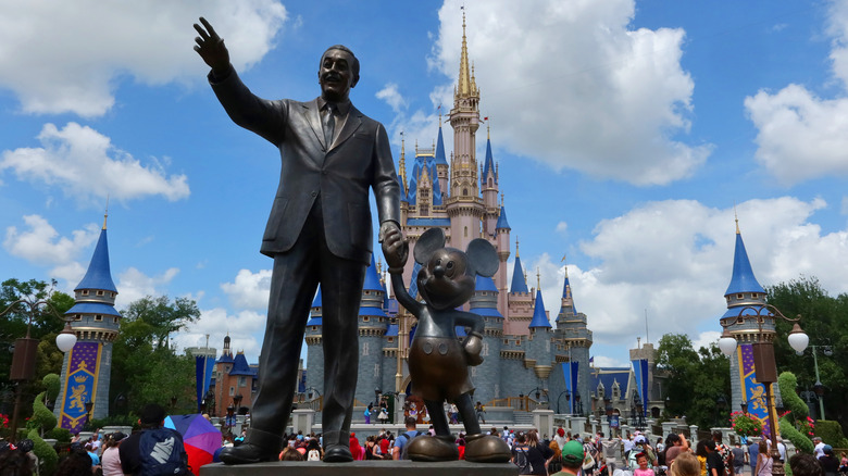 Statue of Mickey and Walt holding hands in Magic Kingdom in walt Disney World