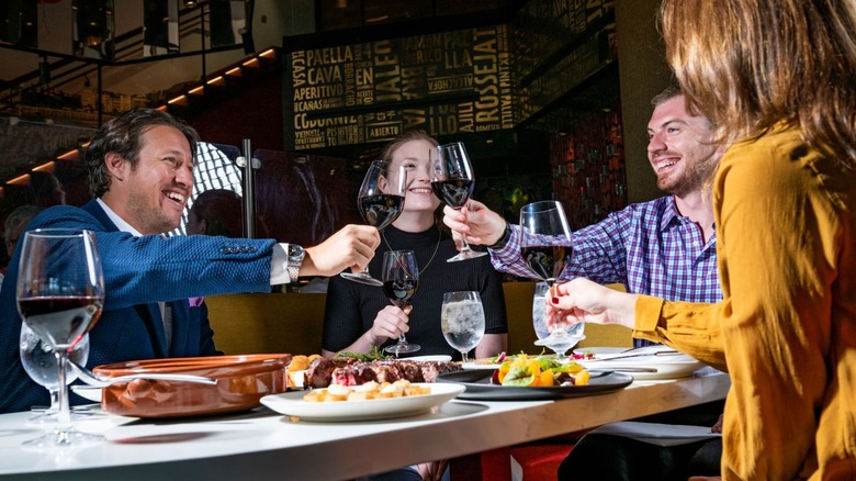 people dining with wine and tapas at Jaleo in Disney Springs