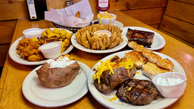 Full spread of Texas Roadhouse food