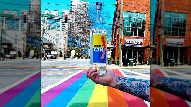 Bottle of Future Gin against rainbow road