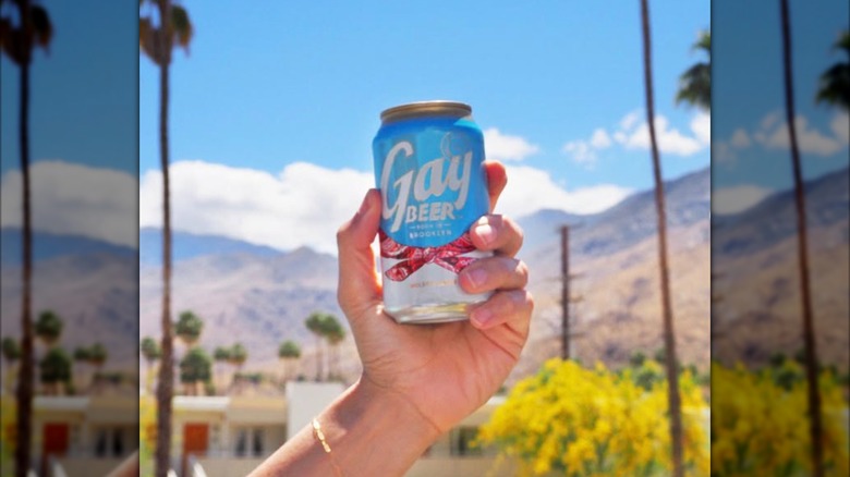 Canned Gay Beer against sunny blue sky