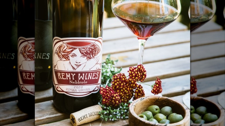 Remi Wines bottle and grapes on a table