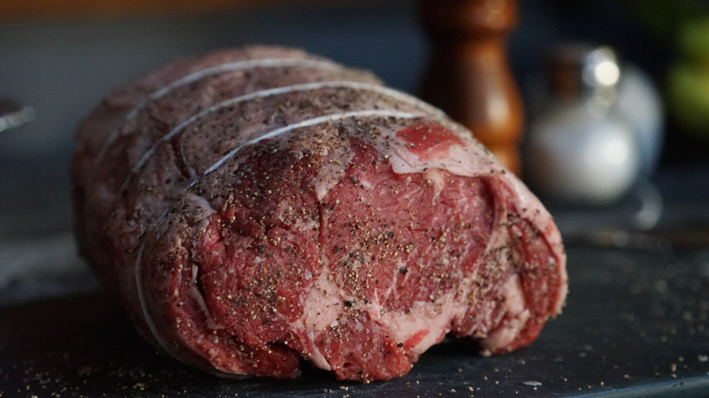 Seasoned prime rib wrapped in twine
