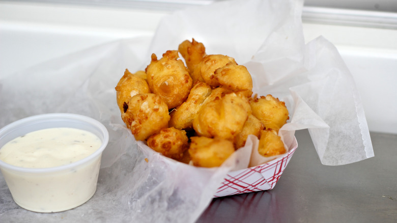 Bowl of fried cheese curds with ranch dip
