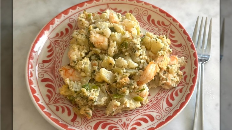 Plate of seafood mirliton with fork