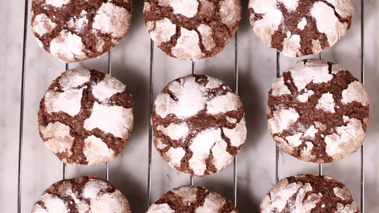 chocolate crinkles on a cooling rack
