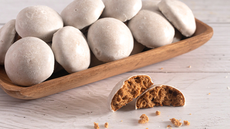 a plate of Pfeffernüsse with one cut in half