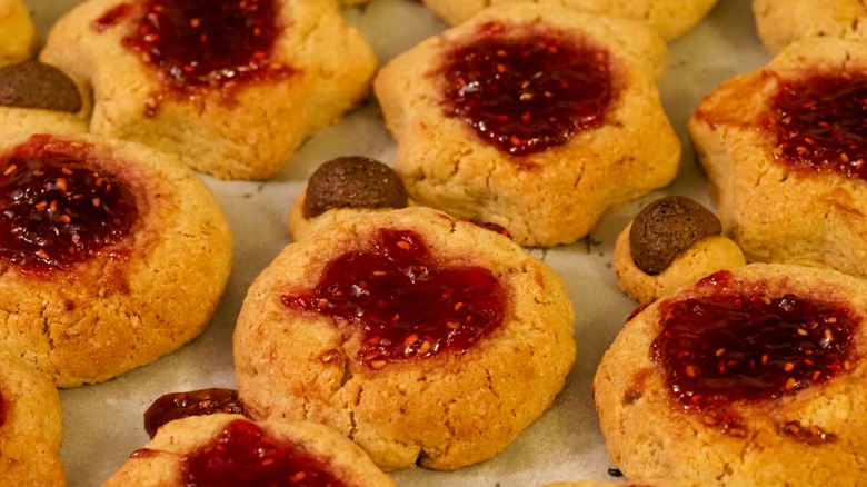a close-up of jam-filled thumbprint cookies