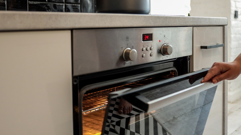 Person opening oven