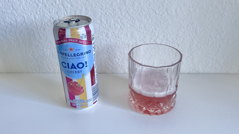 Glass filled with Ciao Cherry Sparkling Water