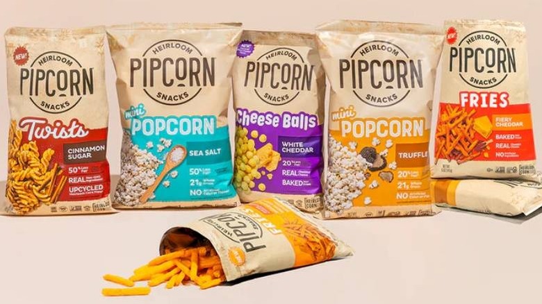 Several packets of Pipcorn Heirloom Snacks placed against an open packet
