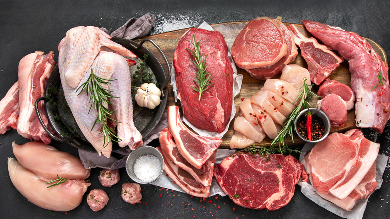 Variety of raw protein cuts like chicken, beef, and pork.