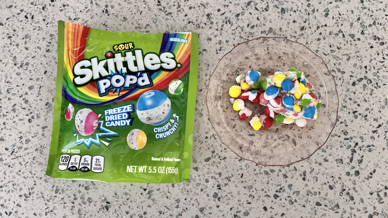 Sour Skittles Pop'd on a plate